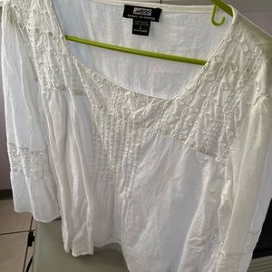 White eyelet top. Bell bottom sleeve